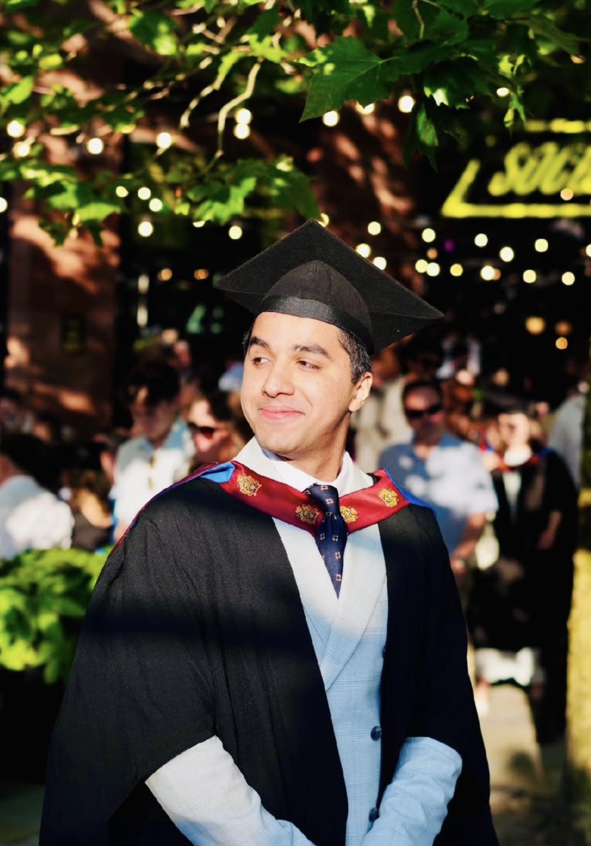 Waqar Shahid in graduation attire outdoors